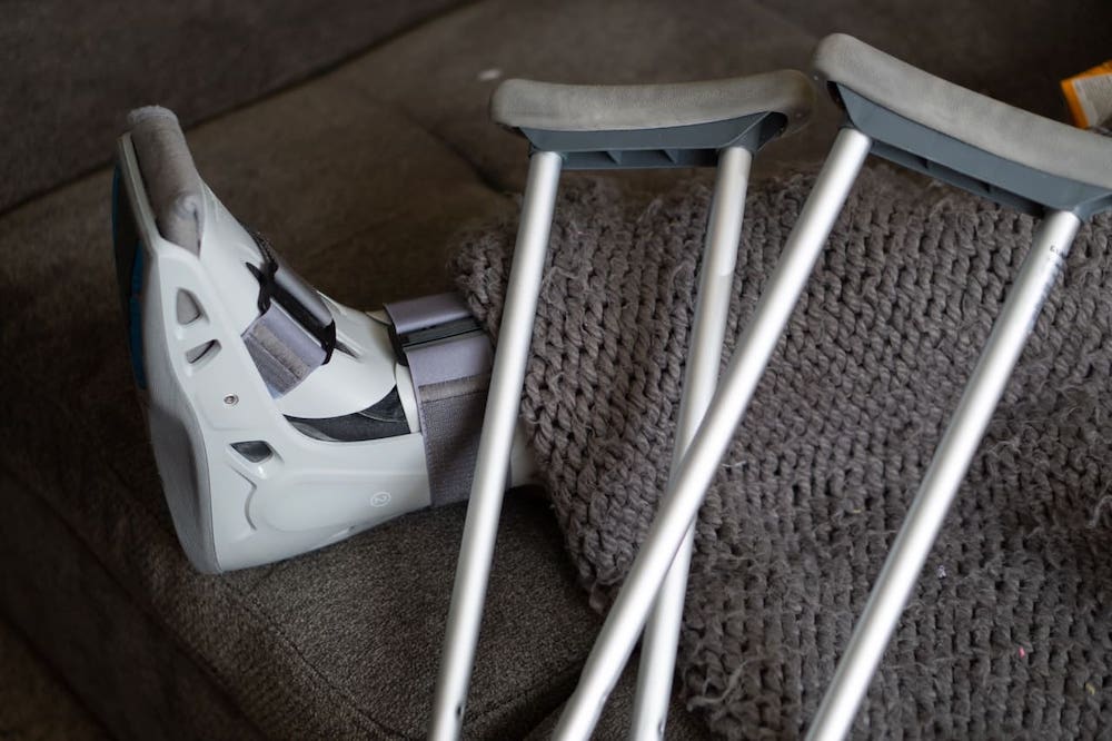 crutches with a walking boot