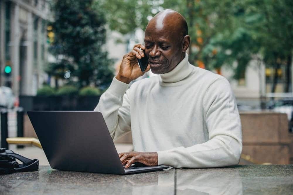 A man is using a laptop